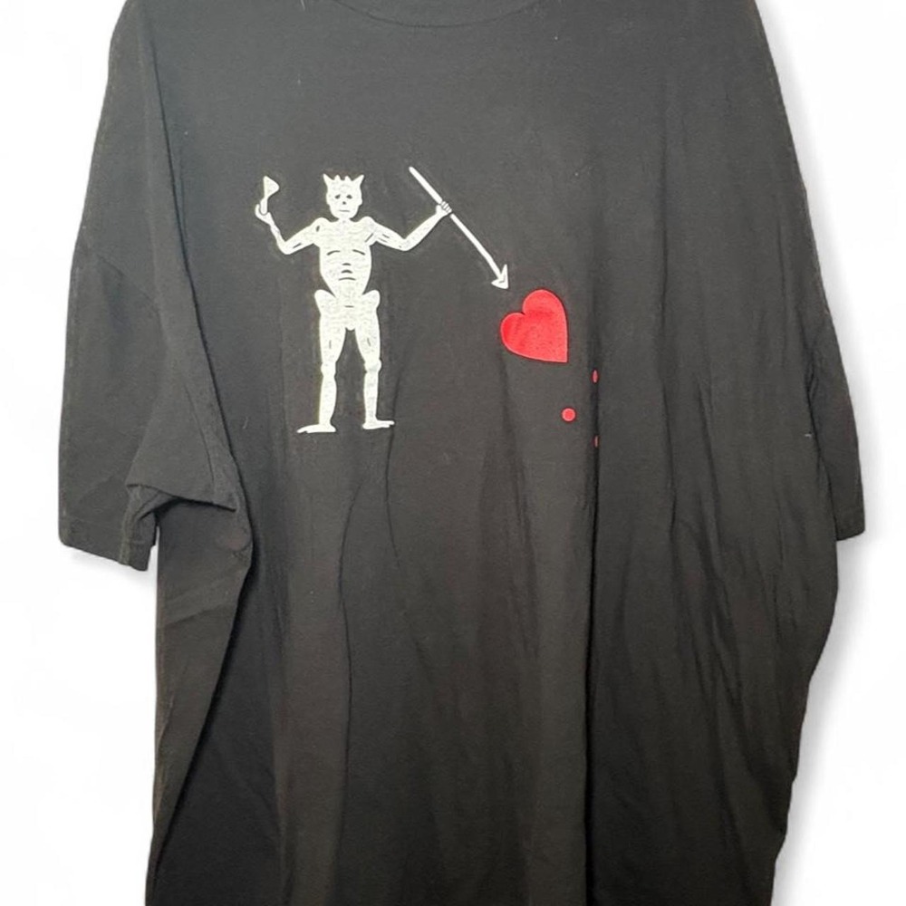 American Spartan Apparel black t-shirt with white devil graphic holding a heart